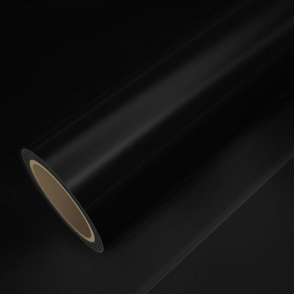 Rolo de vinil preto brilho sobre uma folha do mesmo vinil